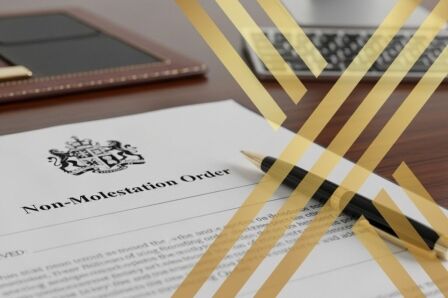 Court gavel and legal papers representing a restraining order issued by a criminal court in the United Kingdom.